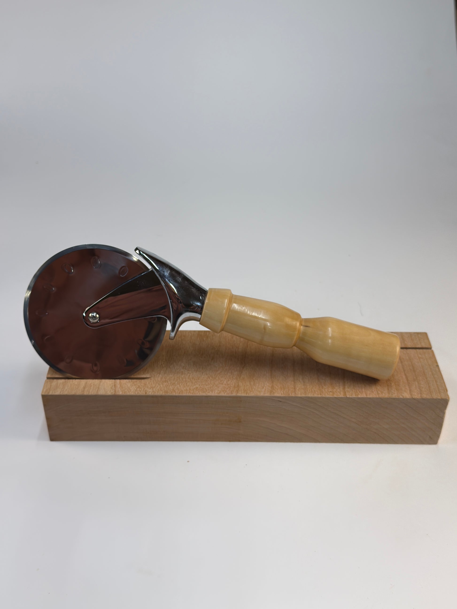 Bradford Pear Pizza Cutter — side view