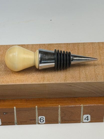 Holly Bottle Stopper — shown with scale reference