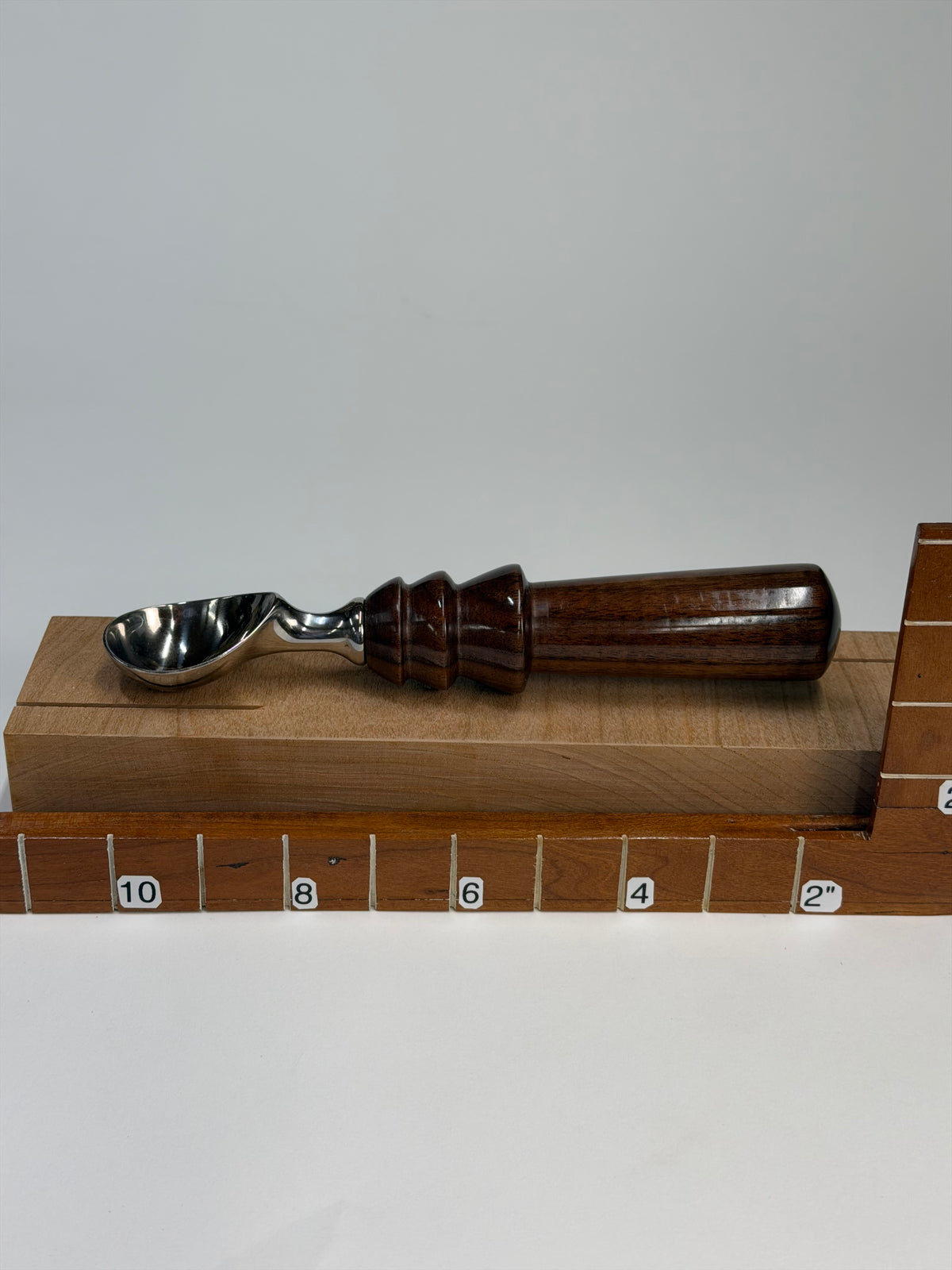 Walnut Ice Cream Scoop II — shown with scale reference