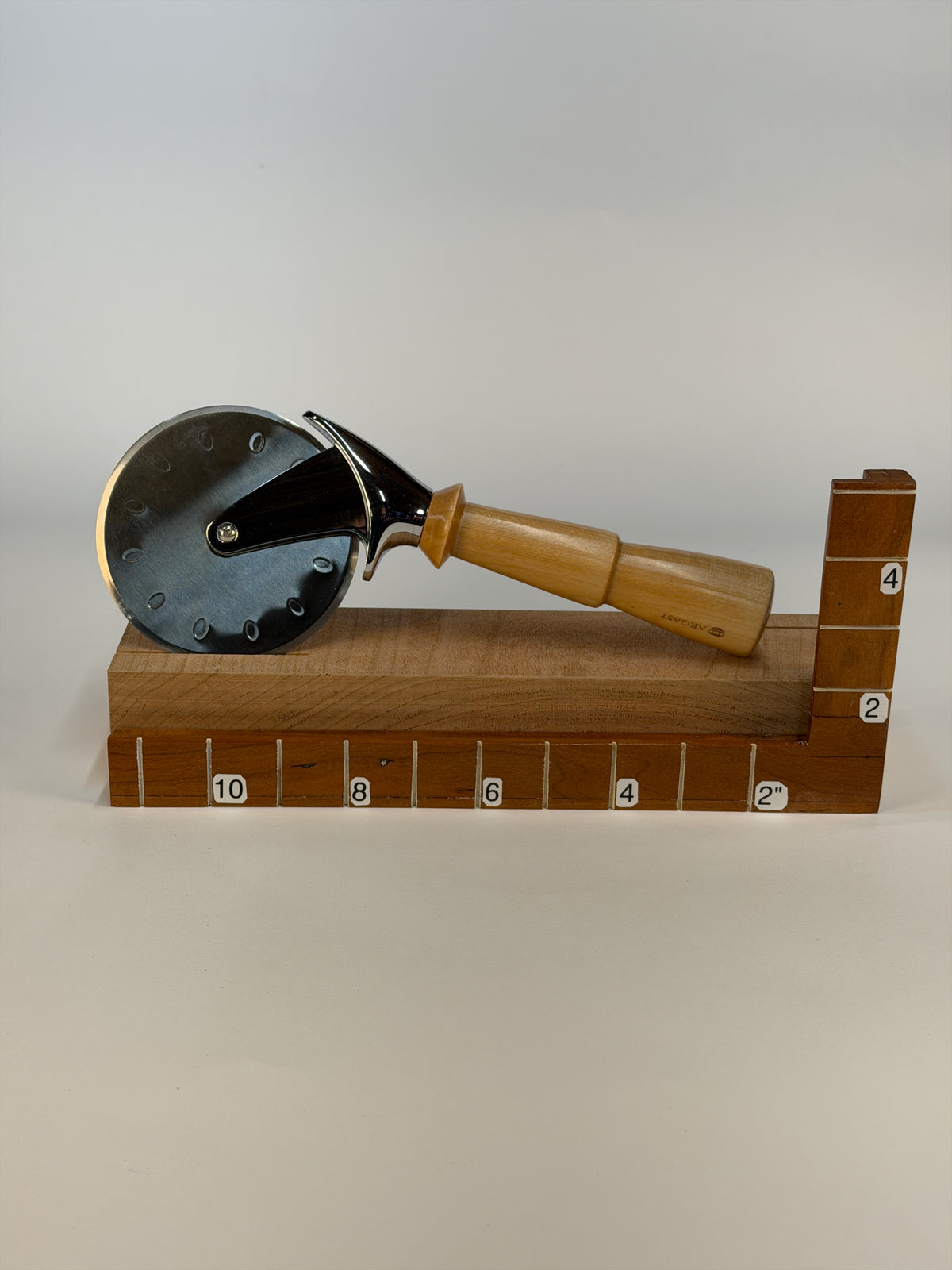 Maple Pizza Cutter I – 10.25" — shown with scale reference