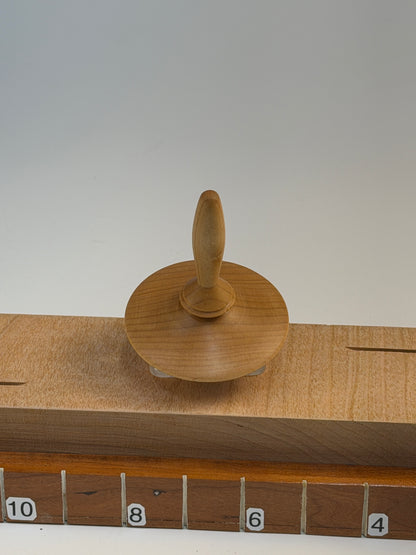 Maple Spinning Top — shown with scale reference
